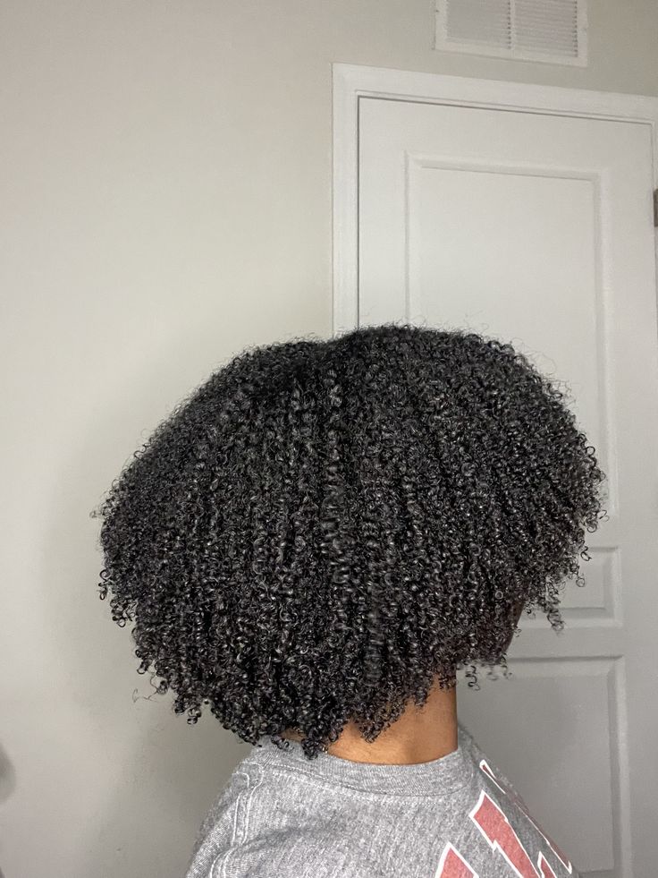 a lady with 4C Hair
