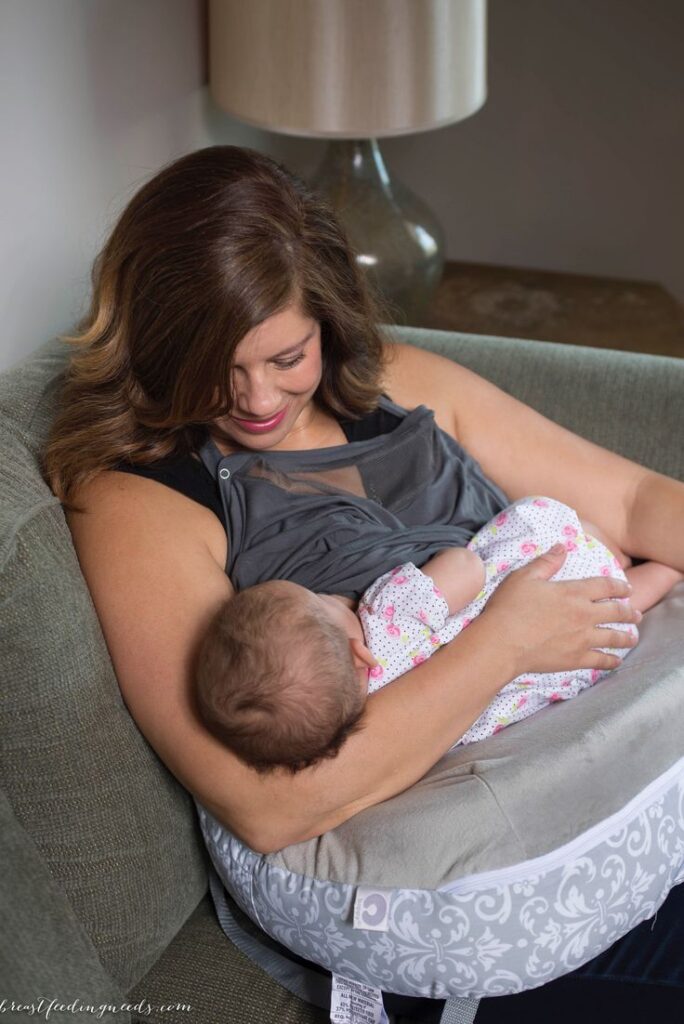 The Ultimate Baby Guide for New Parents: Everything You Need From Pregnancy to Toddlerhood. Newborn baby guide - mother breastfeeding newborn baby at home. With love and Joy