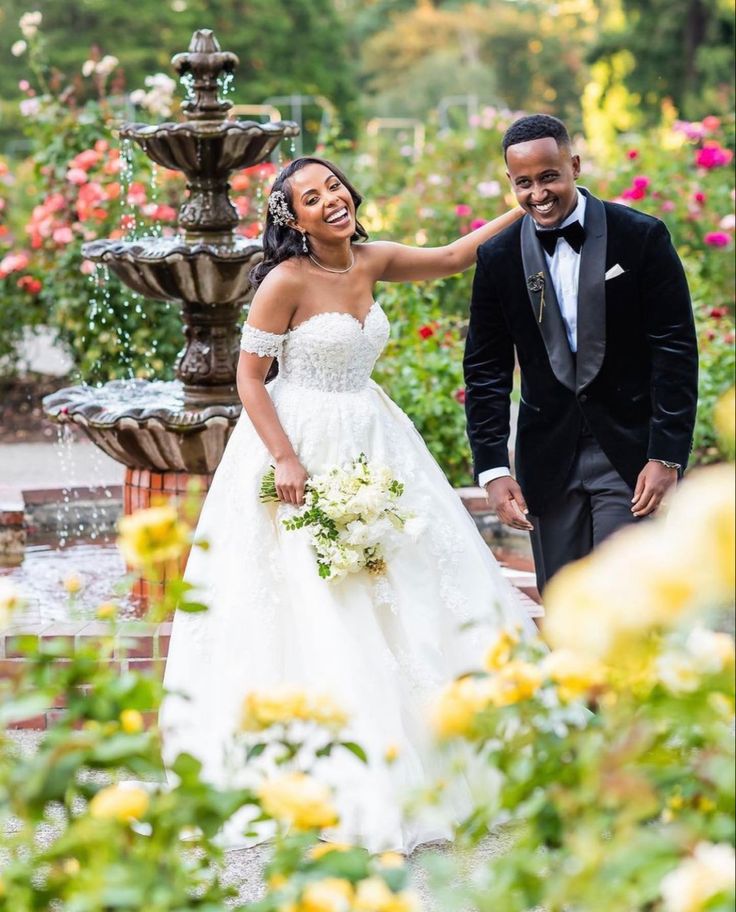 Joyful bride and groom smiling together in their wedding attire as they celebrate their special day.