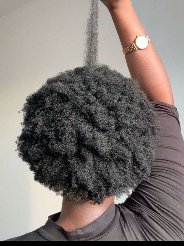 A woman on full 4c hair