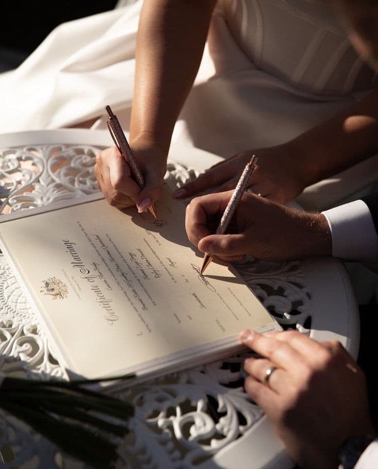 signing marriage certificate outdoors