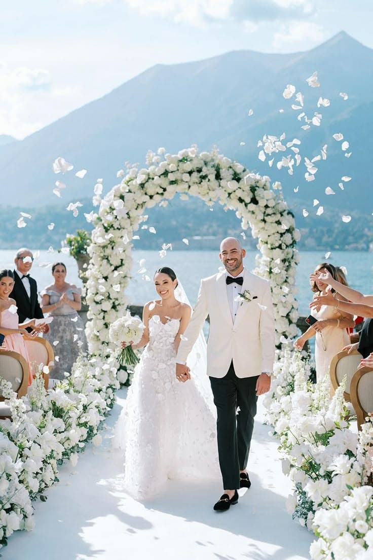 bride and groom smiling hand in hand after destination wedding ceremony
