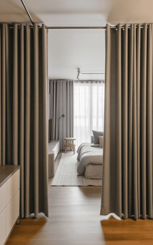 Tall curtains hung close to the ceiling, creating an elegant and spacious look