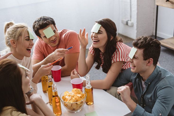 Family and friends playing games together while hosting guests at home