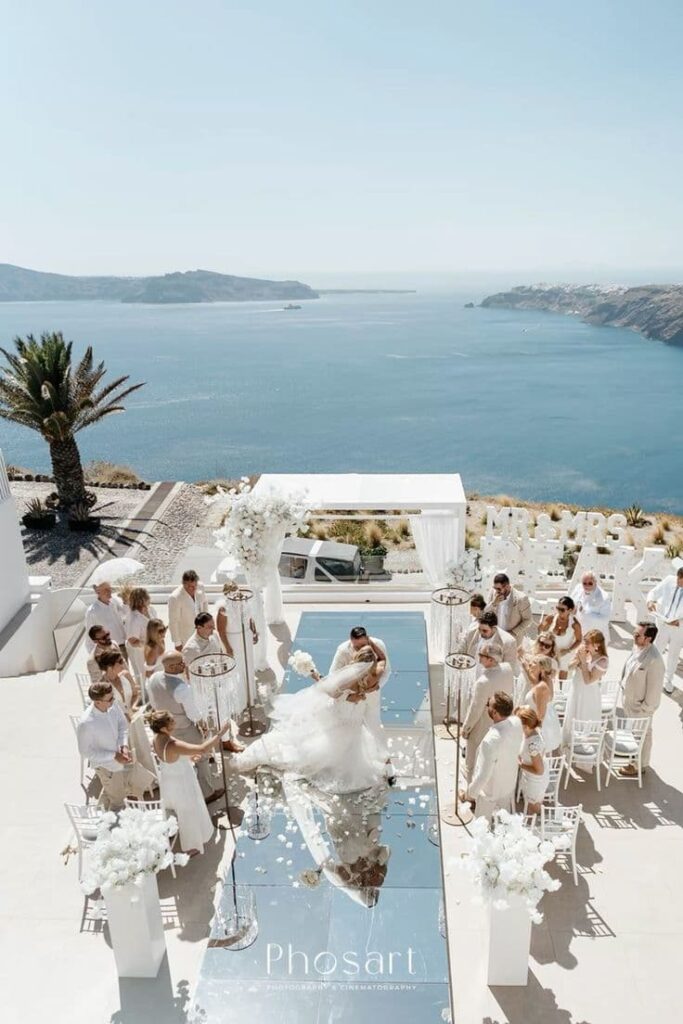 A destination wedding in Santorini overlooking a sea