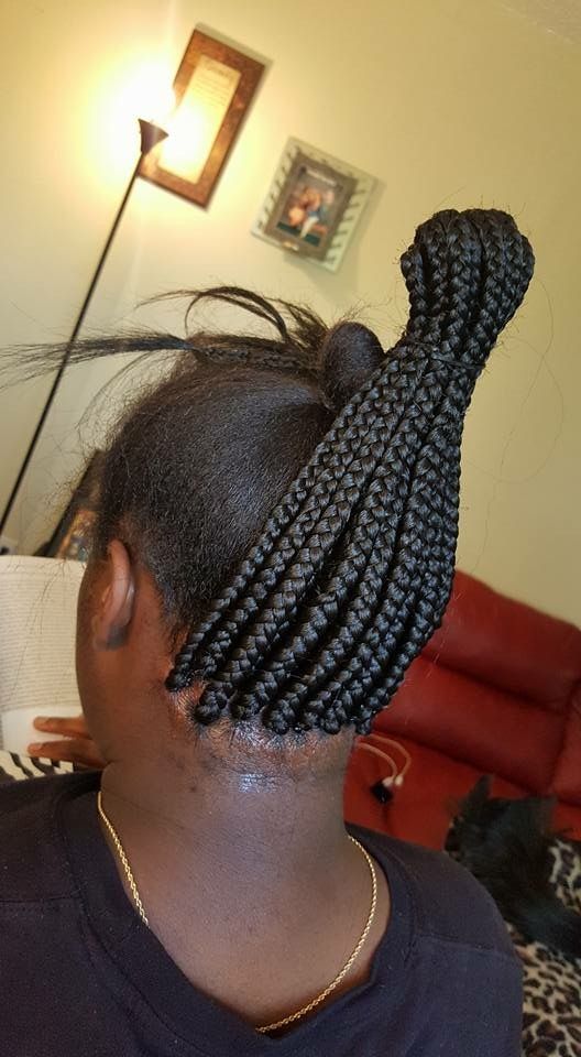 a lady braiding a tight and painful hair