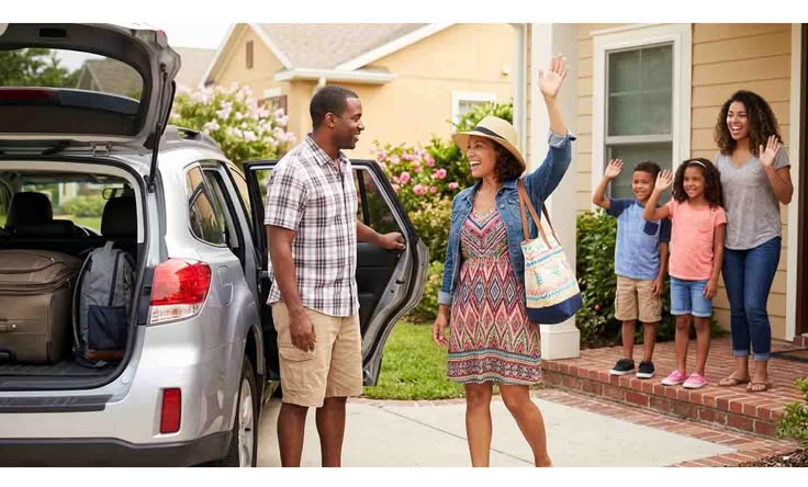 two people saying goodbye as they are about to enter a car