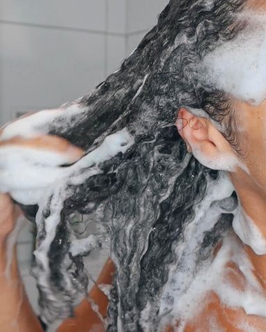 a lady washing her hair