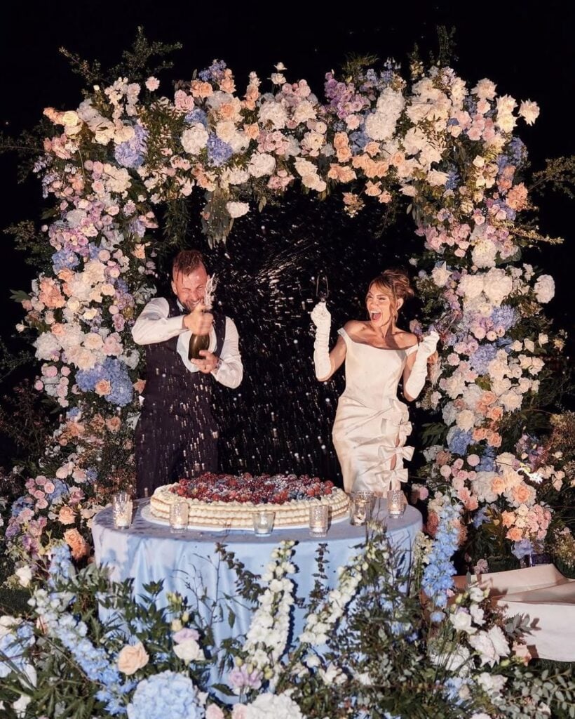 A bride and her groom having fun on their wedding day