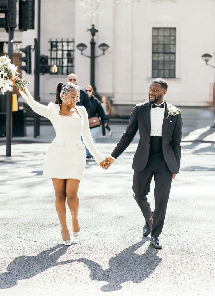 pearl-trimmed mini dress with a birdcage veil