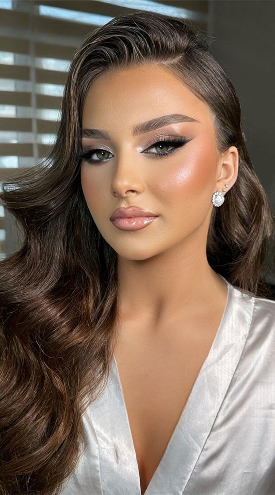 Dark Green Eyed Bride Look Radiating timeless elegance and undeniable allure, the bride with captivating green eyes and luscious dark brown waves