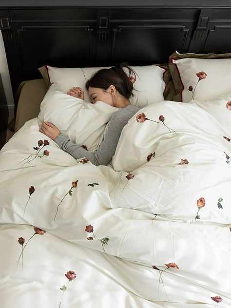 A lady lying on the bed sleeping
