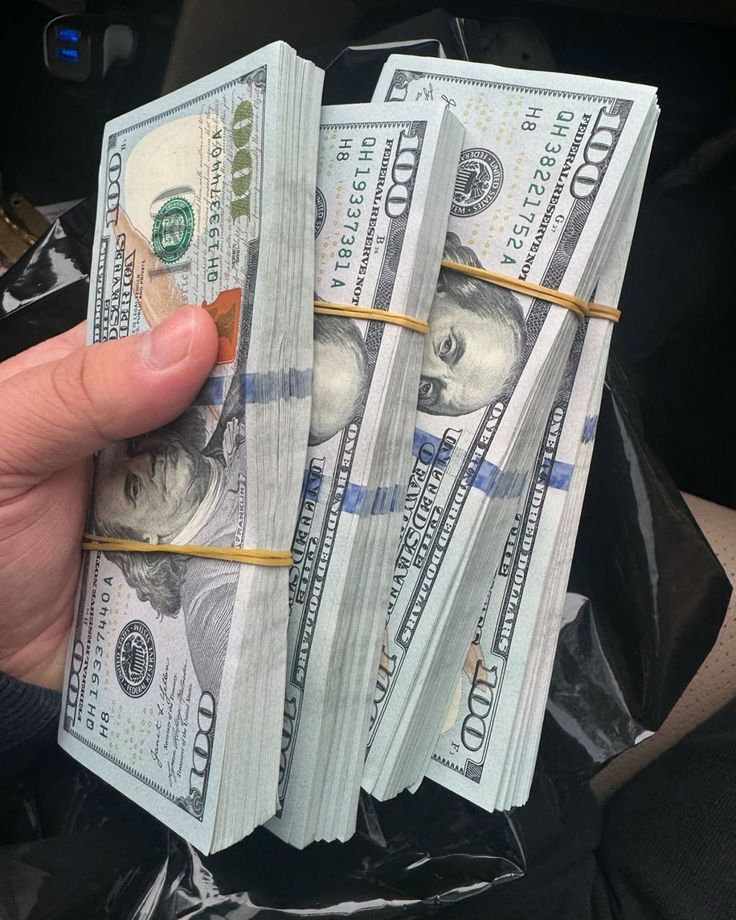 Four tied bundles of 100dollar notes
