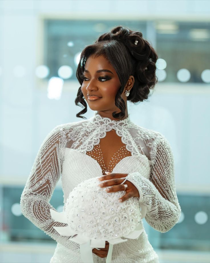 A beautiful bride on a hick neck wedding dress holding a beautiful white bouquet