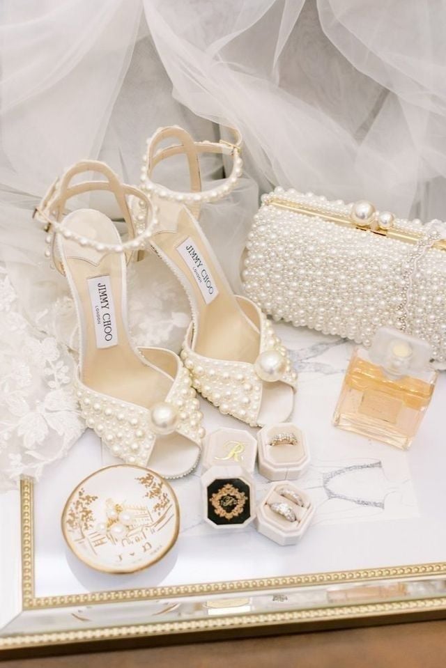 A pair of shoe, chain purse, jewelries and other wedding accessories