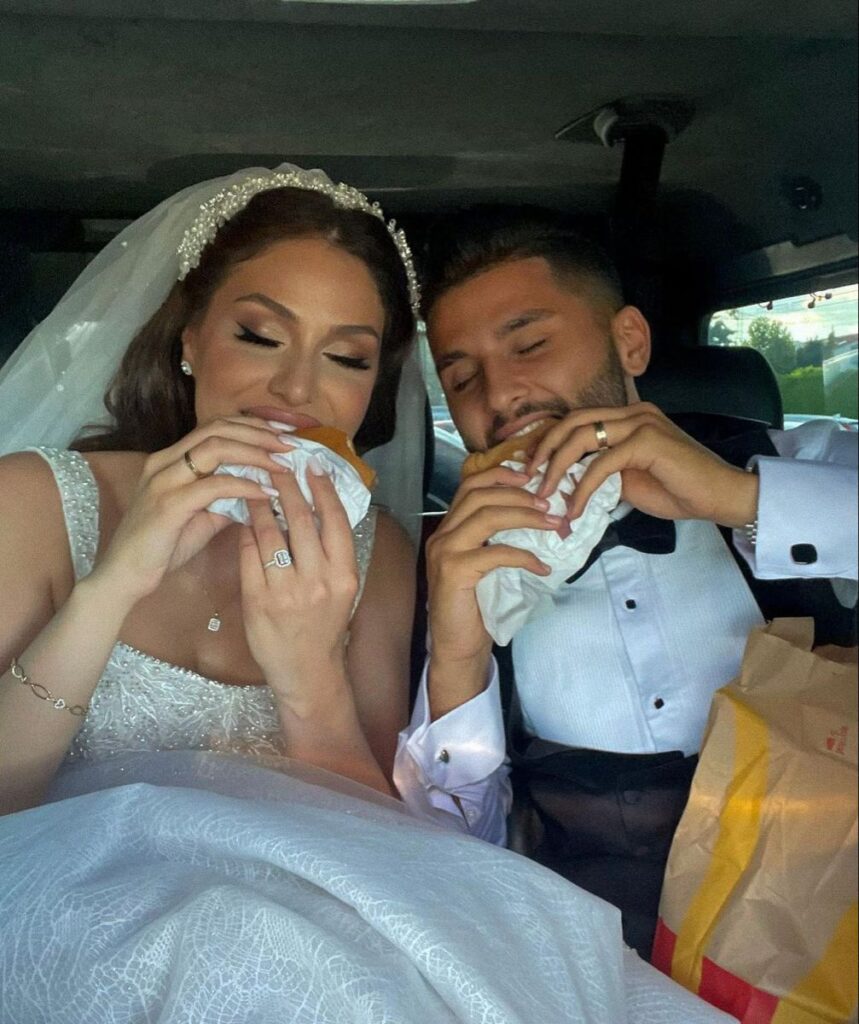 bride and groom eating snack